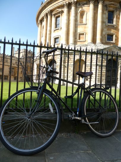 Bicycle against railings at Radcliffe Camera in Oxford