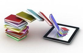 A pile of books cascading into a Tablet | Phil Isherwood